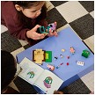 Lifestyle view highlighting the manual building and assembly process of the LEGO<sup>®</sup> Bluey 11216 Grannies with Bingo and Bluey model. 