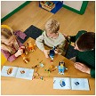 Lifestyle view highlighting the manual building and assembly process of the LEGO<sup>®</sup> Bluey 11217 Brick-Built Bluey Family - "Damaged Box" model. 