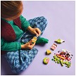 Lifestyle view highlighting the manual building and assembly process of the LEGO® Classic 11039 Creative Food Friends model. 