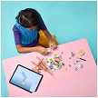 Lifestyle view highlighting the manual building and assembly process of the LEGO<sup>®</sup> Creator 31390 Floral Art Decor Painting model. 