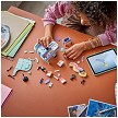 Lifestyle view highlighting the manual building and assembly process of the LEGO<sup>®</sup> Creator 31392 Music Decor Piano with Cat model. 