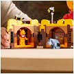 Lifestyle view highlighting the manual building and assembly process of the LEGO® | Disney™ 43300 Winnie the Pooh model. 