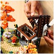 Lifestyle view highlighting the manual building and assembly process of the LEGO® Icons 11372 Autumn Cottage Garden model. 
