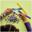 Lifestyle view highlighting the manual building and assembly process of the LEGO® DOTS 41807 Bracelet Designer Mega Pack (SOLD OUT) model. 