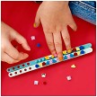Lifestyle view highlighting the manual building and assembly process of the LEGO® DOTS 41923 Monster Bracelets (SOLD OUT) model. 