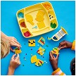 Lifestyle view highlighting the manual building and assembly process of the LEGO® DOTS 41948 Cute Banana Pen Holder (SOLD OUT) model. 